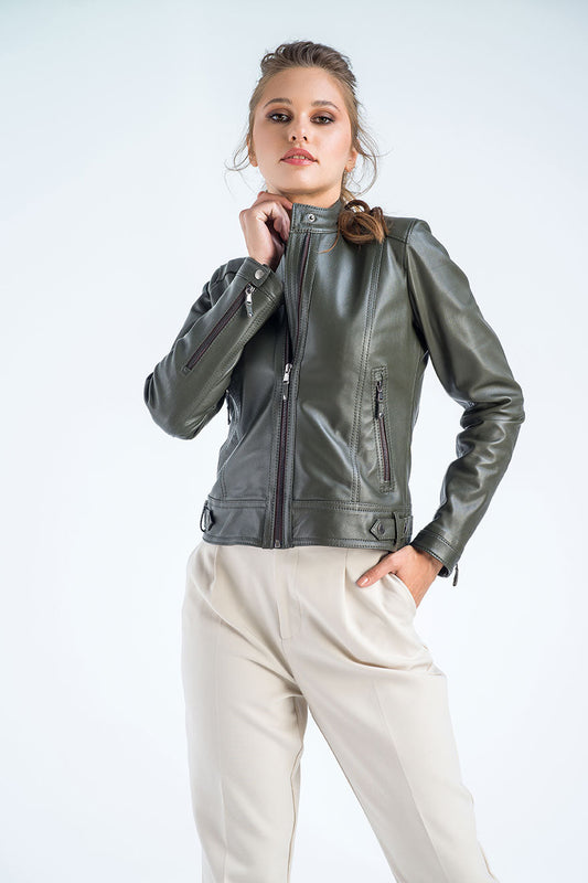 Woman wearing a green leather jacket on a white background