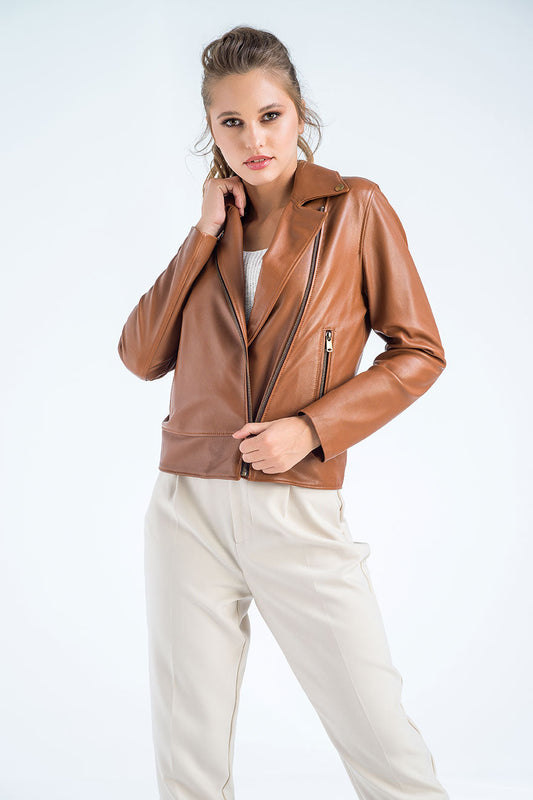 Woman wearing a brown leather jacket on a white background