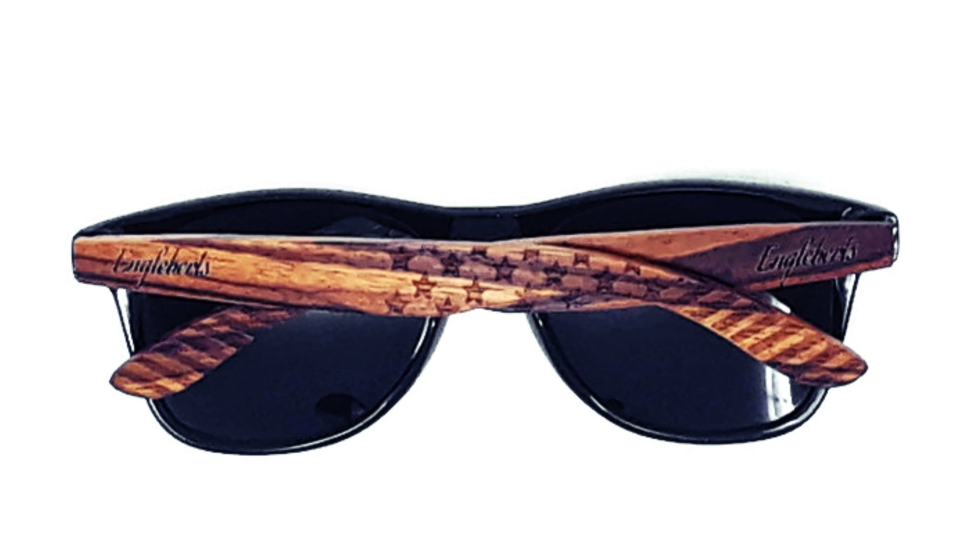Sunglasses with wooden frame and black lenses on a white background