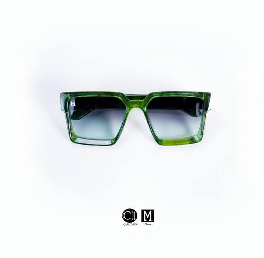 Green sunglasses with a gradient lens on a white background, featuring the brand 'CIM'.