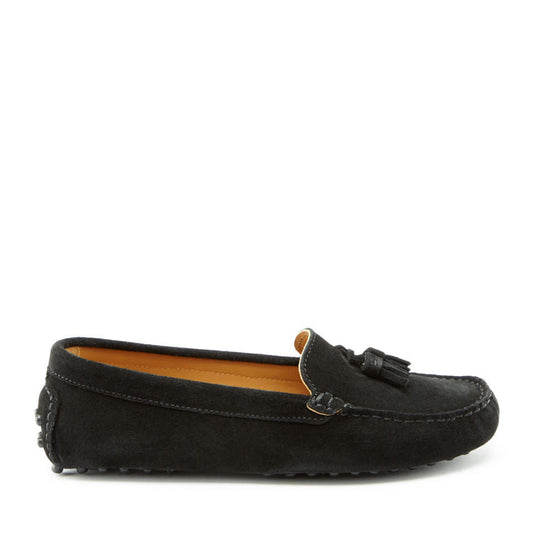 Black suede loafer with a tassel on a white background
