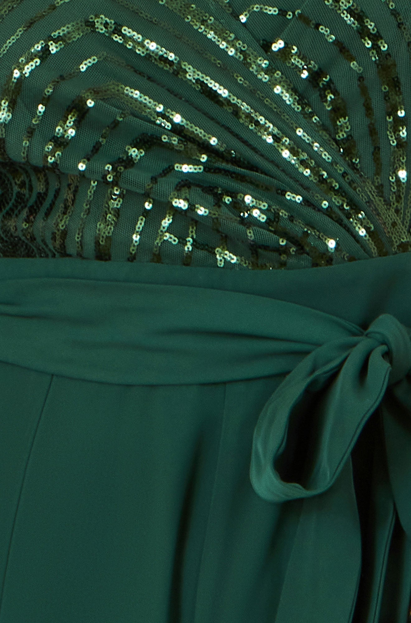 Close-up of a green dress with sequin detailing