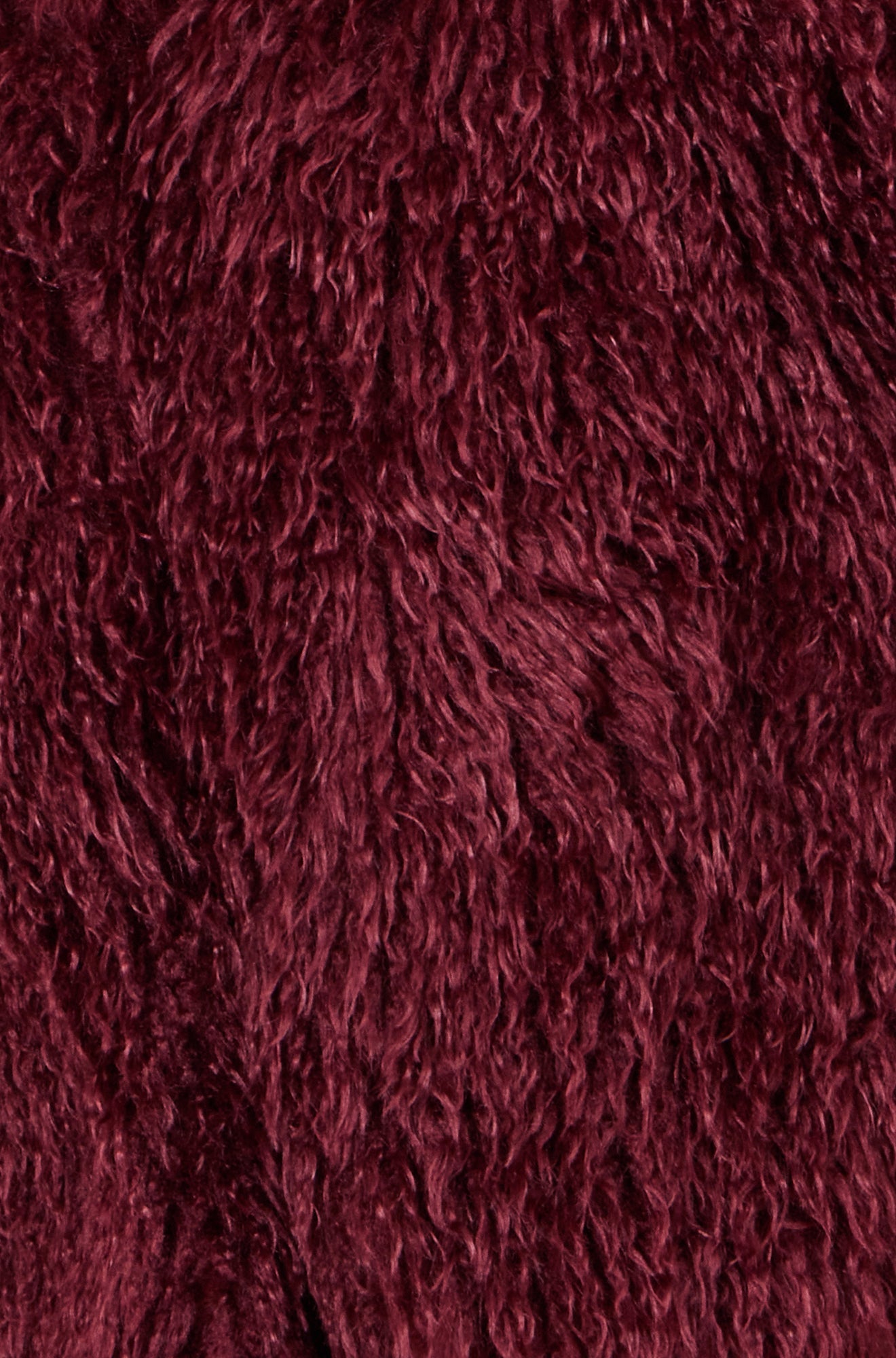 Close-up of a textured burgundy fabric surface