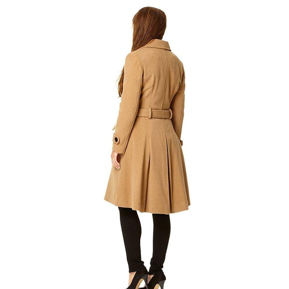 Woman wearing a beige trench coat on a white background