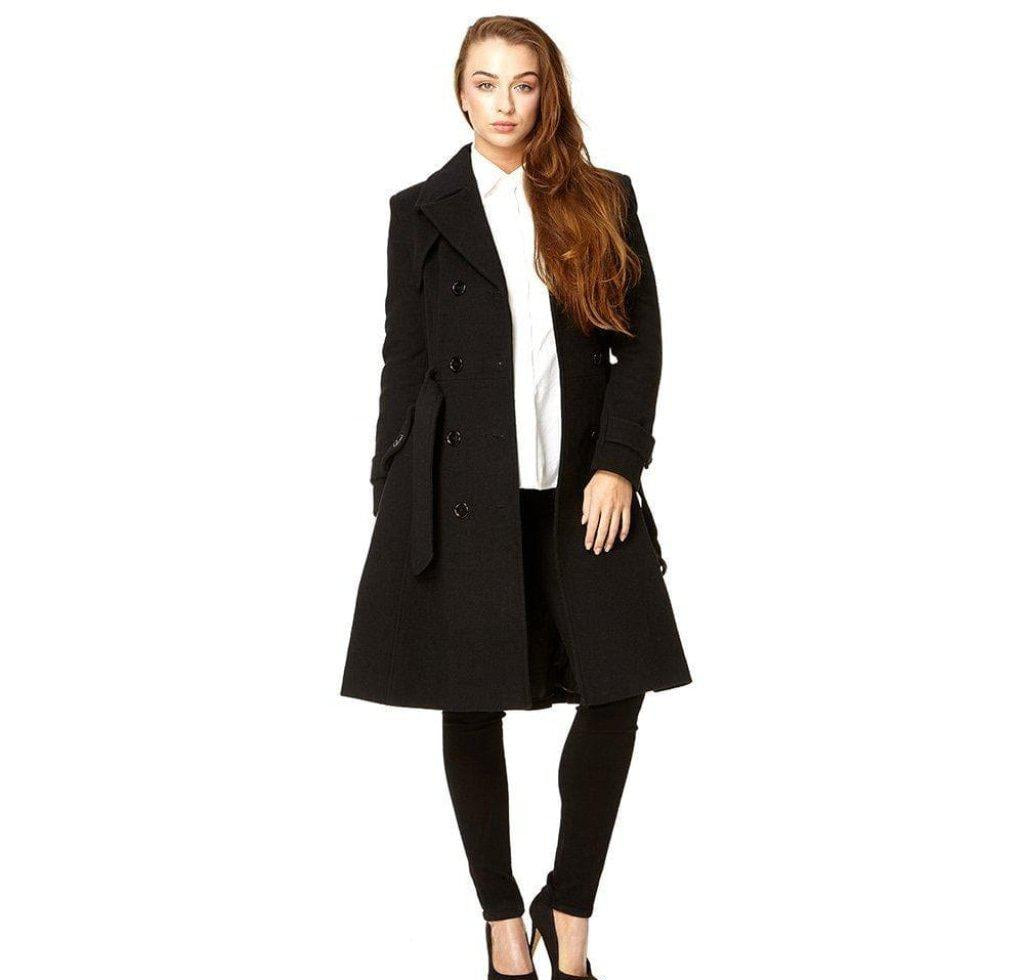 Woman wearing a black coat over a white shirt on a white background