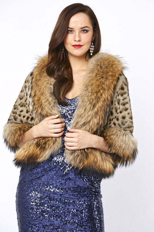 Woman wearing a blue sequin dress with a fur coat on a white background
