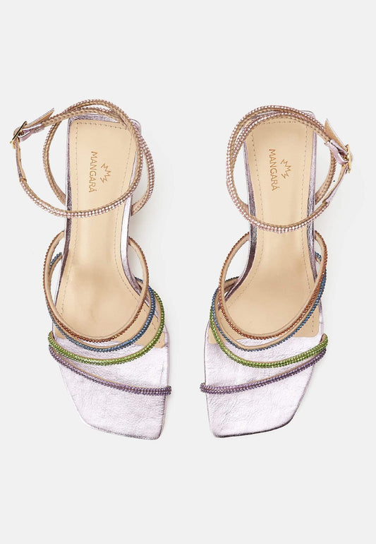 Pair of embellished high-heeled sandals on a white background