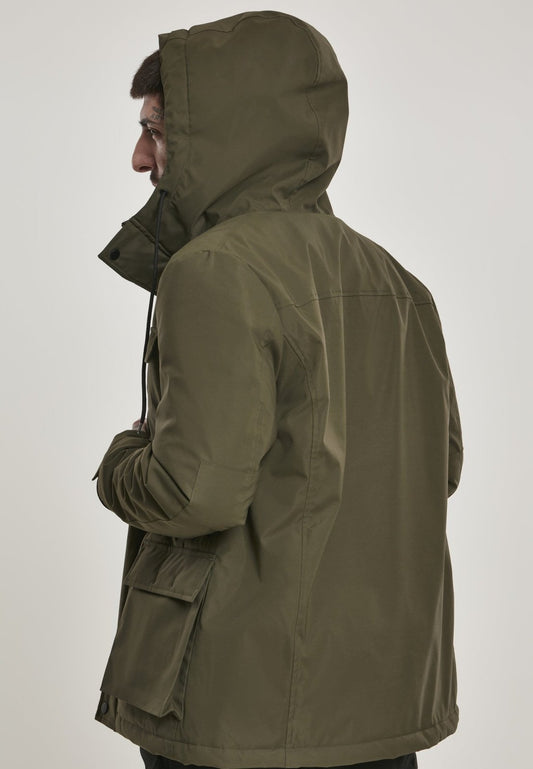Person wearing a green hooded jacket on a white background