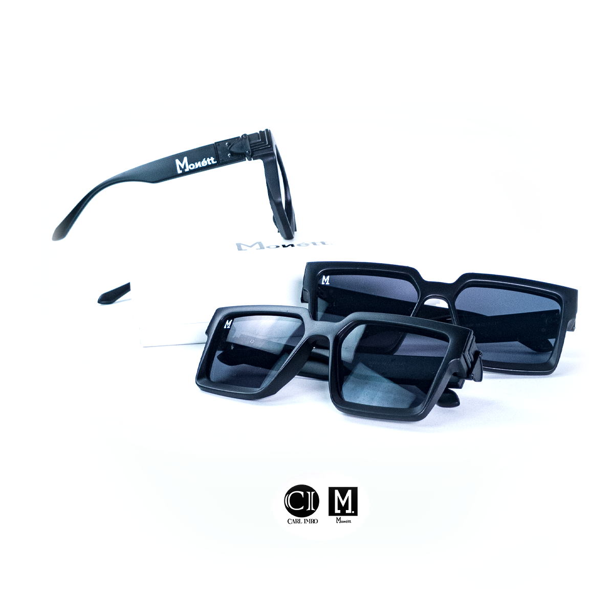 Black sunglasses with 'Monnet' branding on a white background
