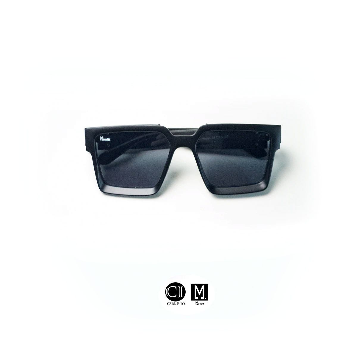 Black sunglasses on a white background with a visible brand logo.