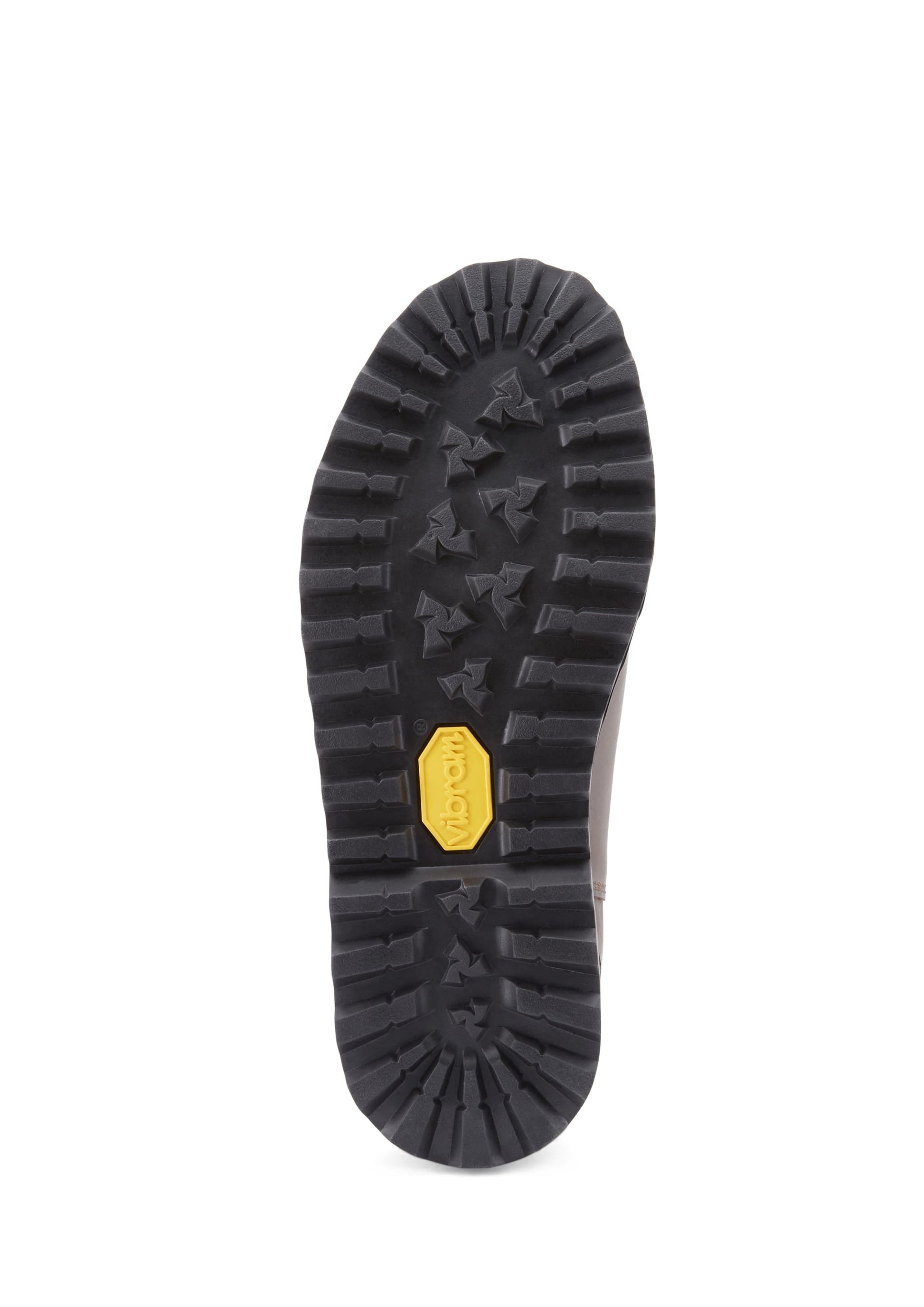 Close-up of a black rubber sole with a yellow label on a white background