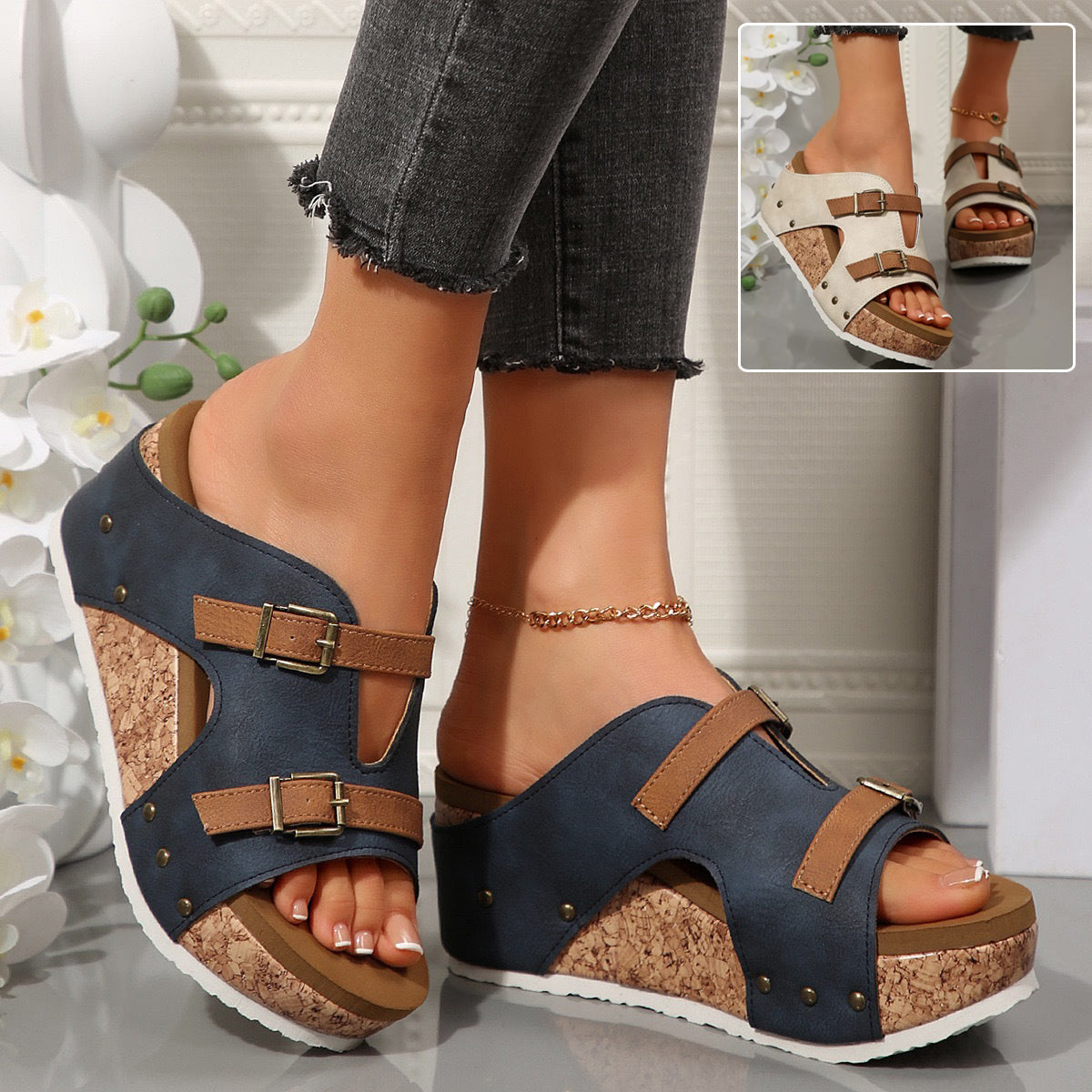 Blue sandals with brown accents worn by a person, with a close-up inset showing the shoe details.