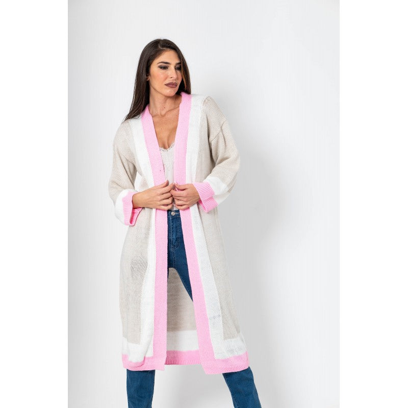 Woman wearing a long, light-colored cardigan with pink trim on a white background