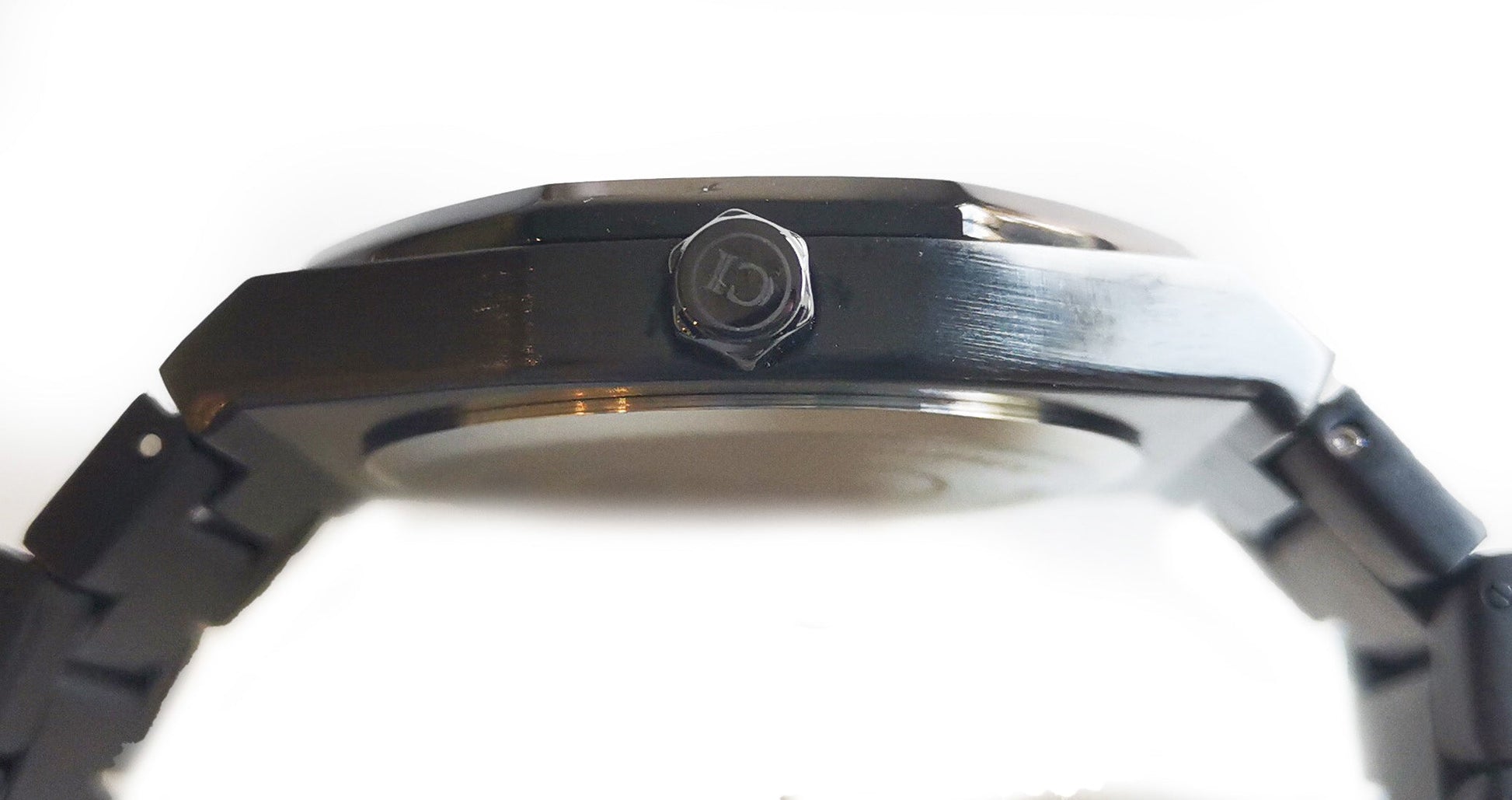 Close-up of a watch band with a brand logo on a white background