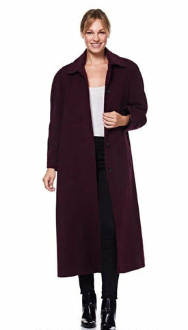 Woman wearing a long dark coat