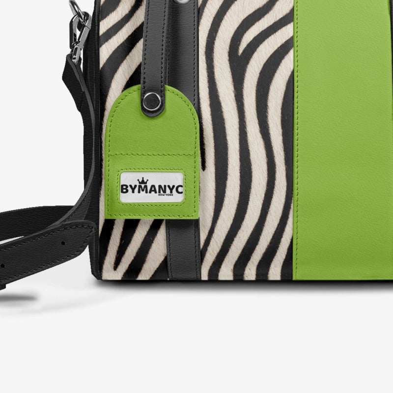 Green and zebra-patterned bag with a visible brand tag on a white background