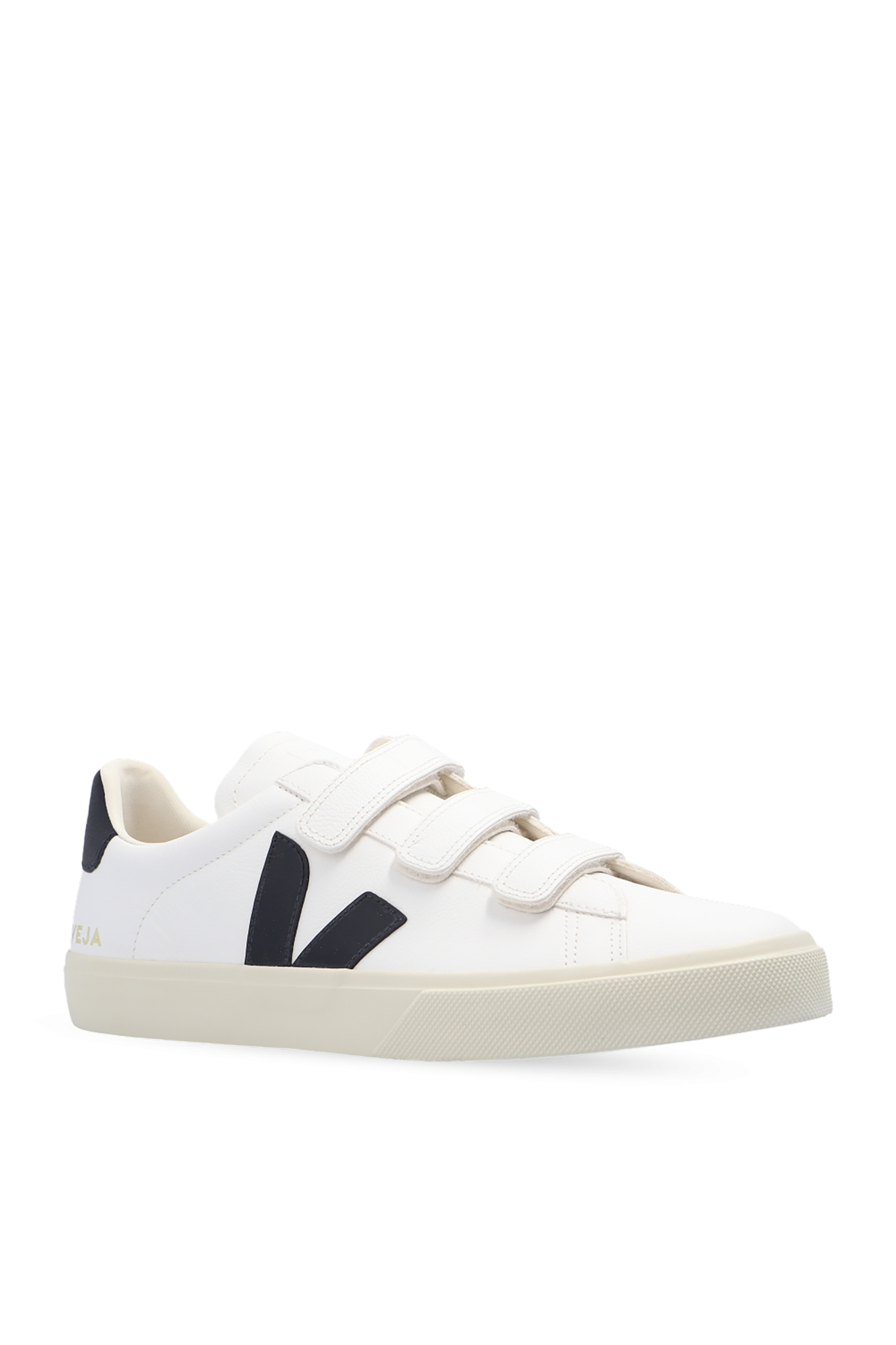 White sneakers with black accents on a white background