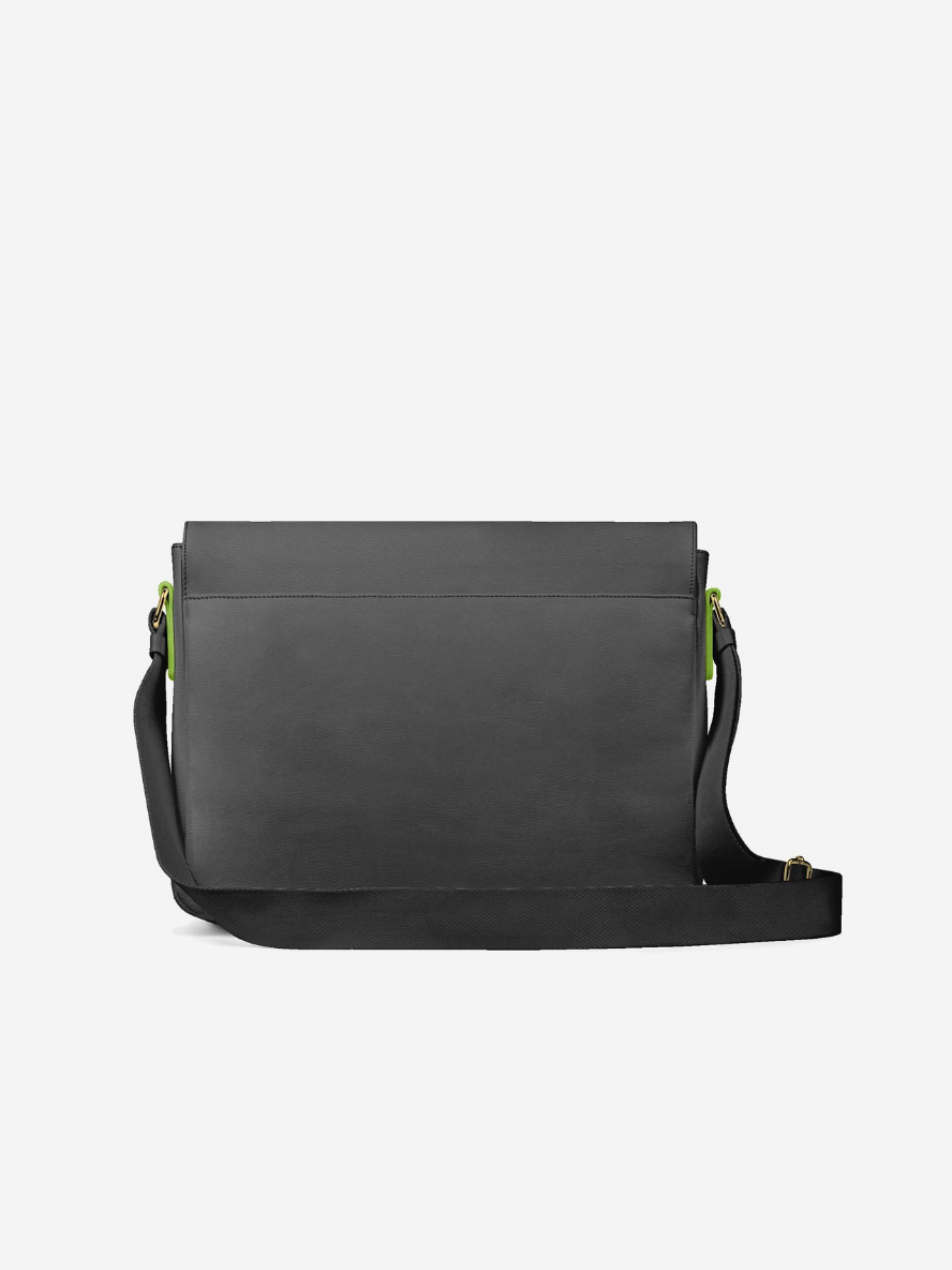 Black crossbody bag with green accents on a white background