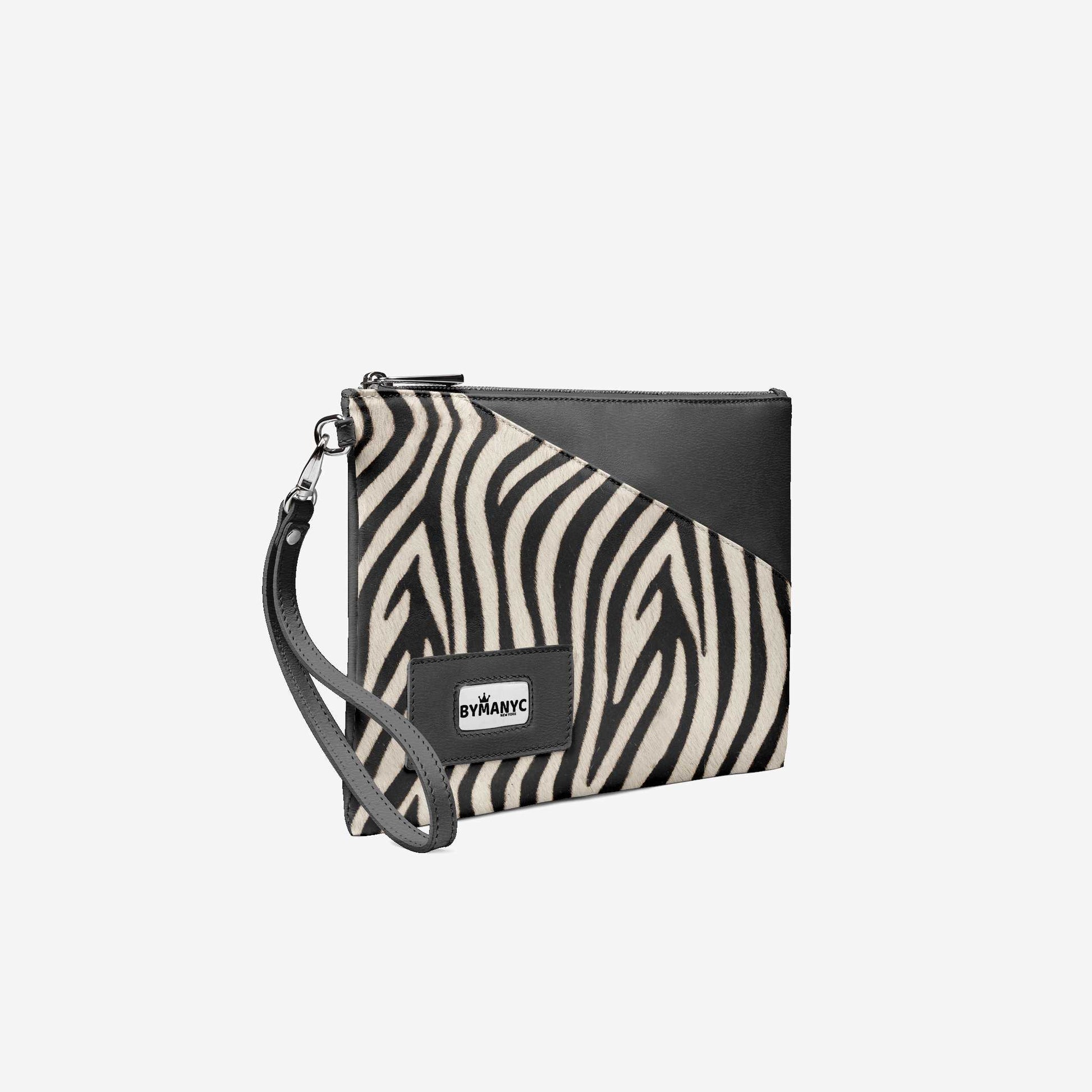 Zebra print clutch bag with black leather accents on a white background
