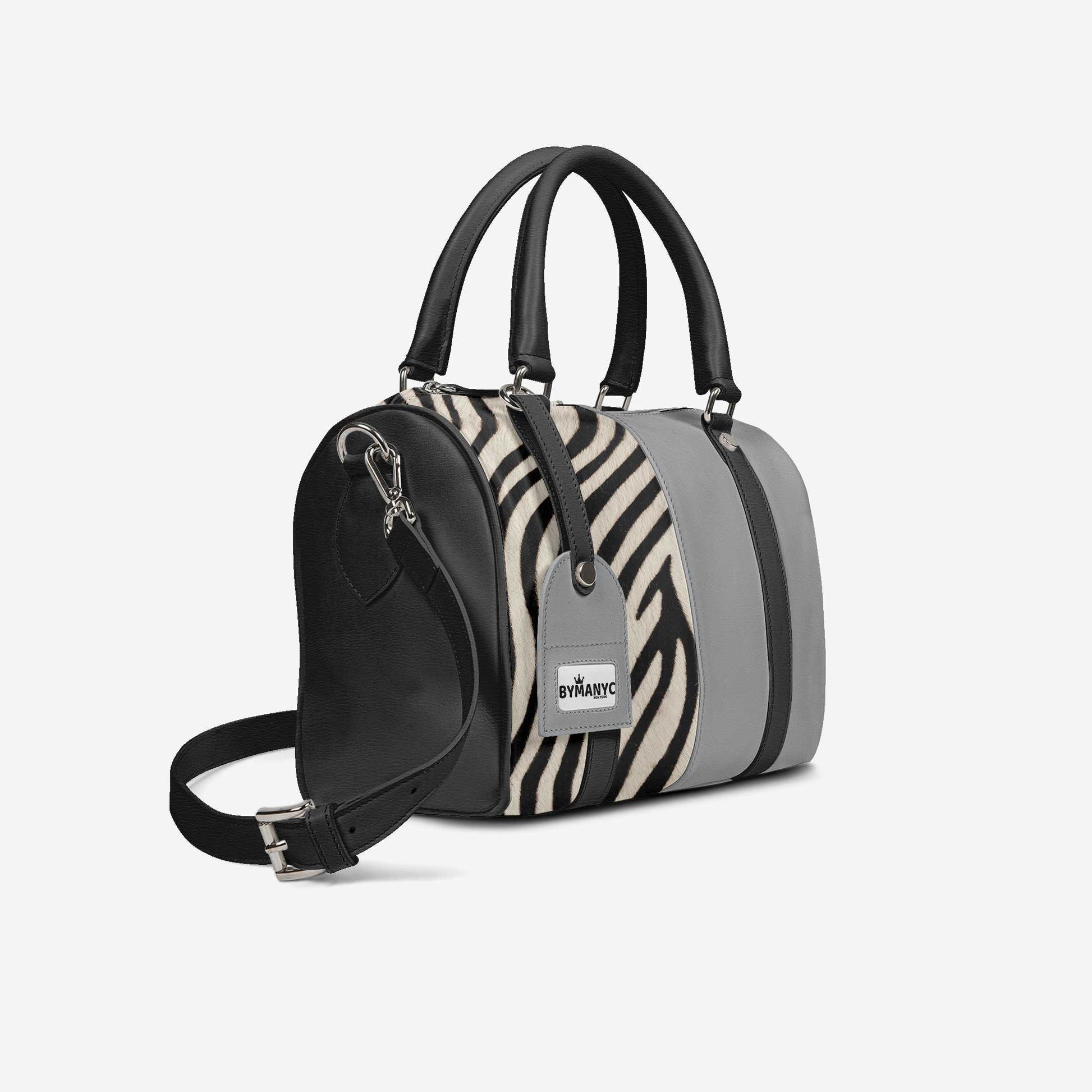 Handbag with zebra pattern and gray accents on a white background