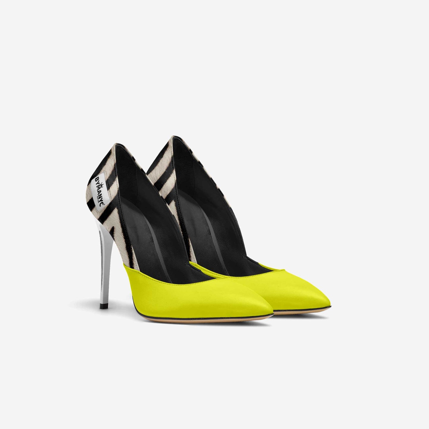 Pair of high-heeled shoes with black and yellow design on a white background