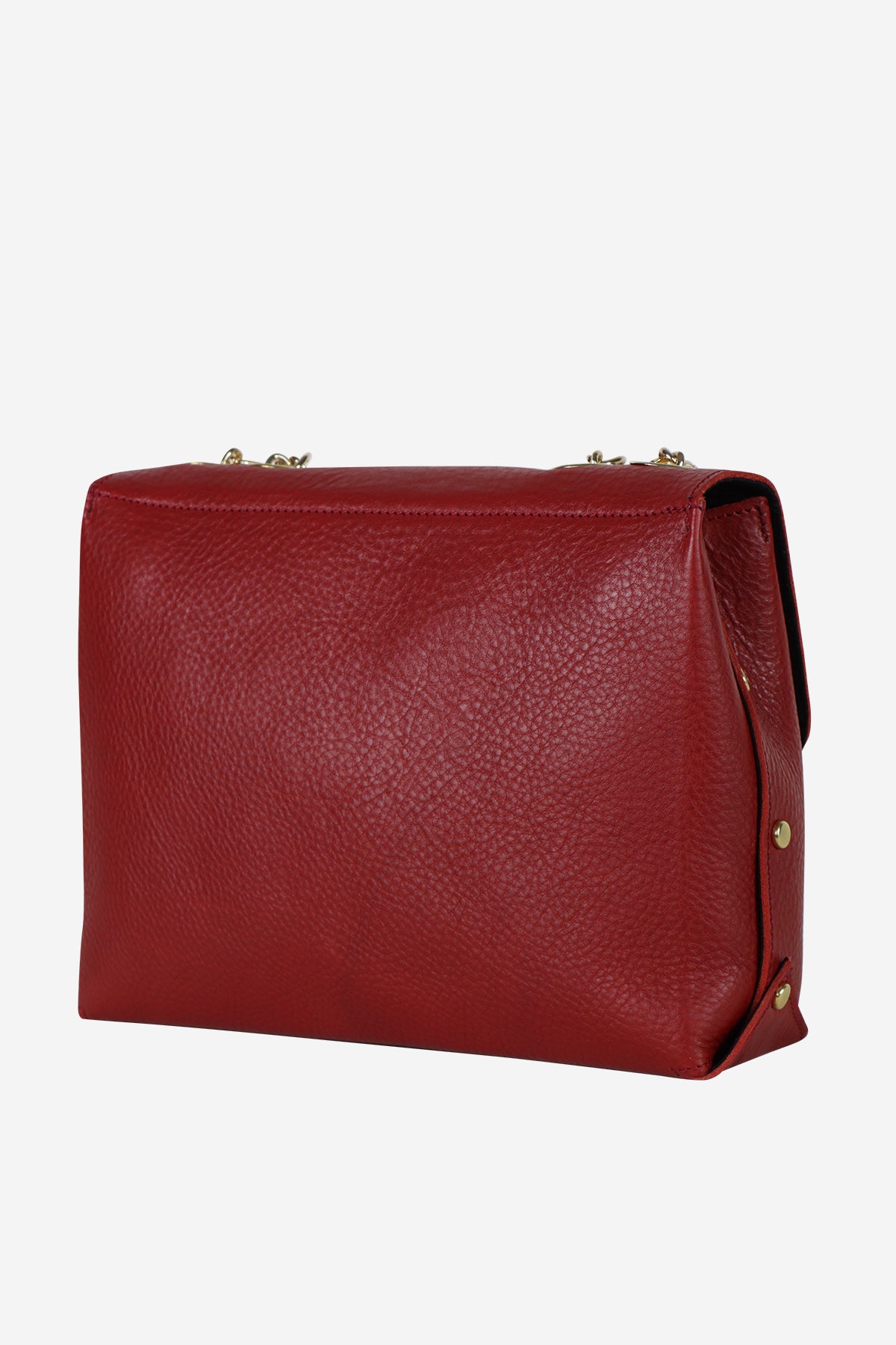 Red leather handbag on a white background