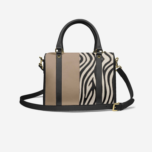 Handbag with zebra print section on a white background