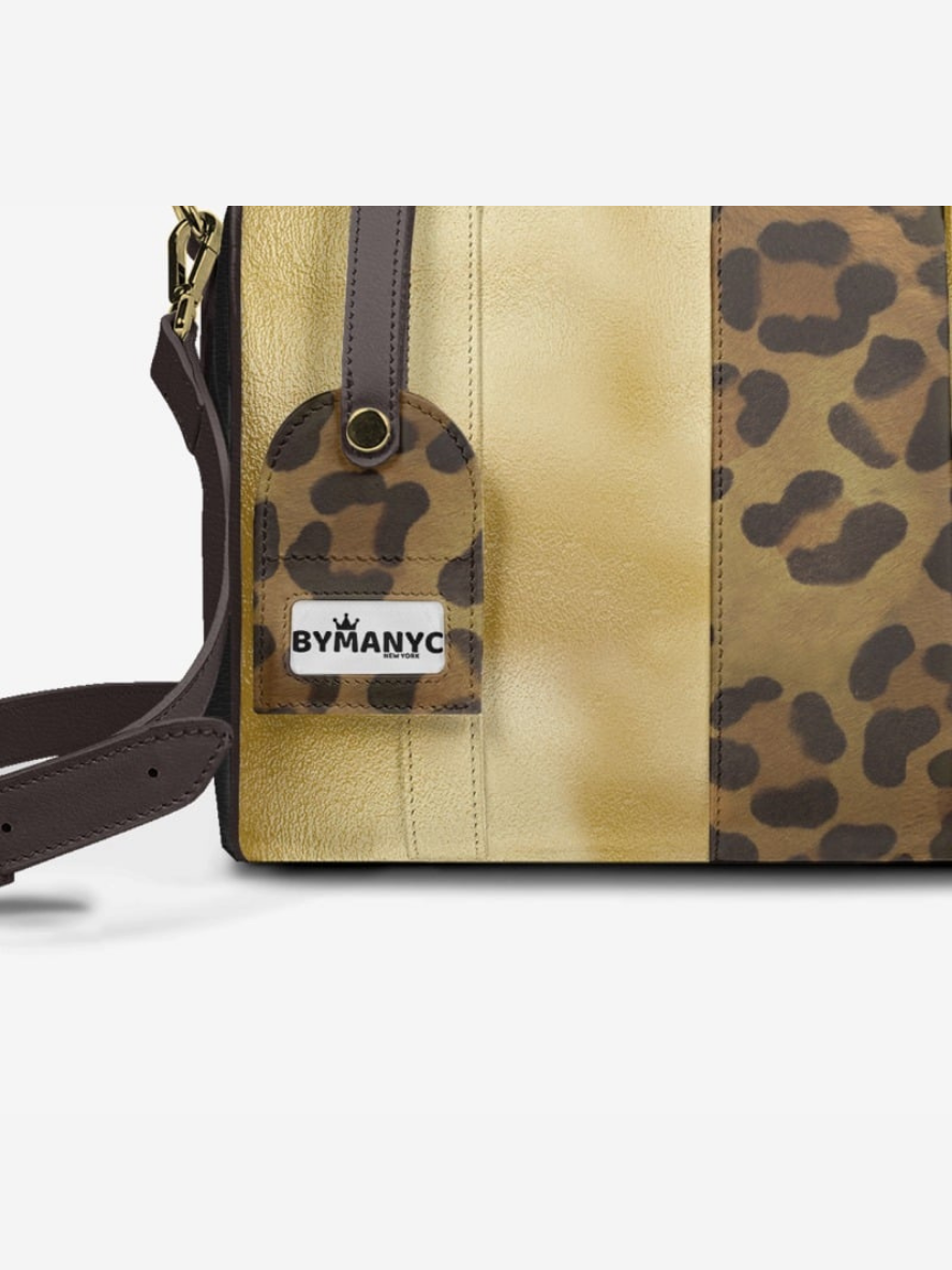Handbag with leopard print and beige sections, featuring a ByManyC brand tag.