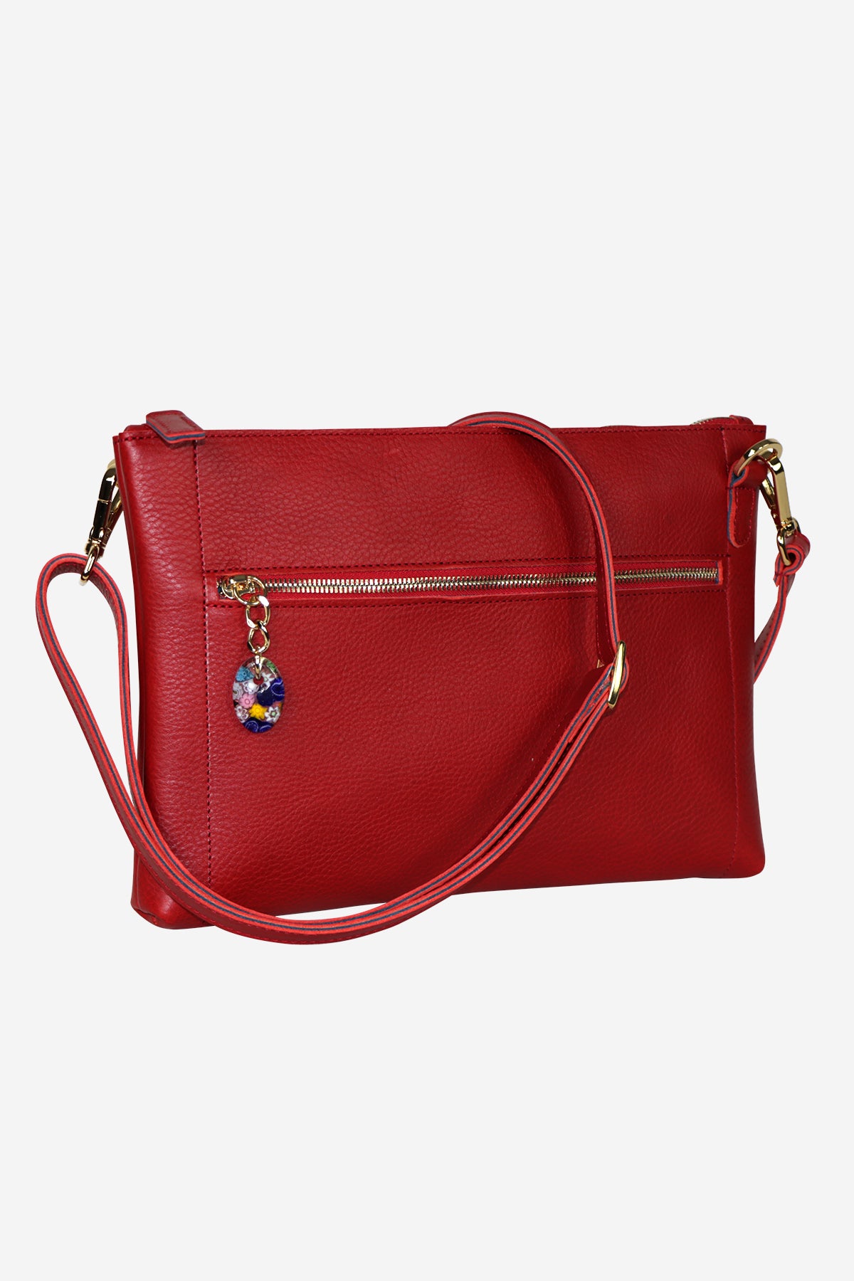 Red handbag with a colorful charm on a white background