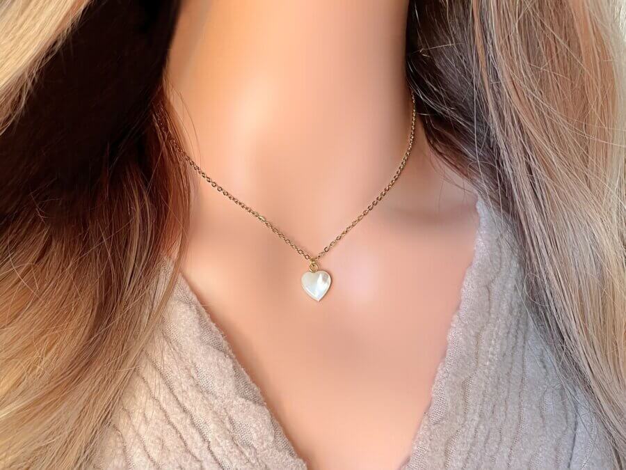 Necklace with a heart-shaped pendant on a mannequin