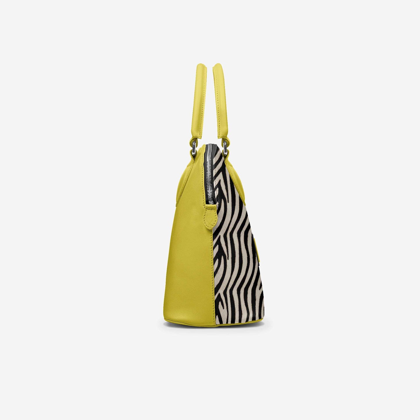 Yellow handbag with zebra pattern interior on a white background