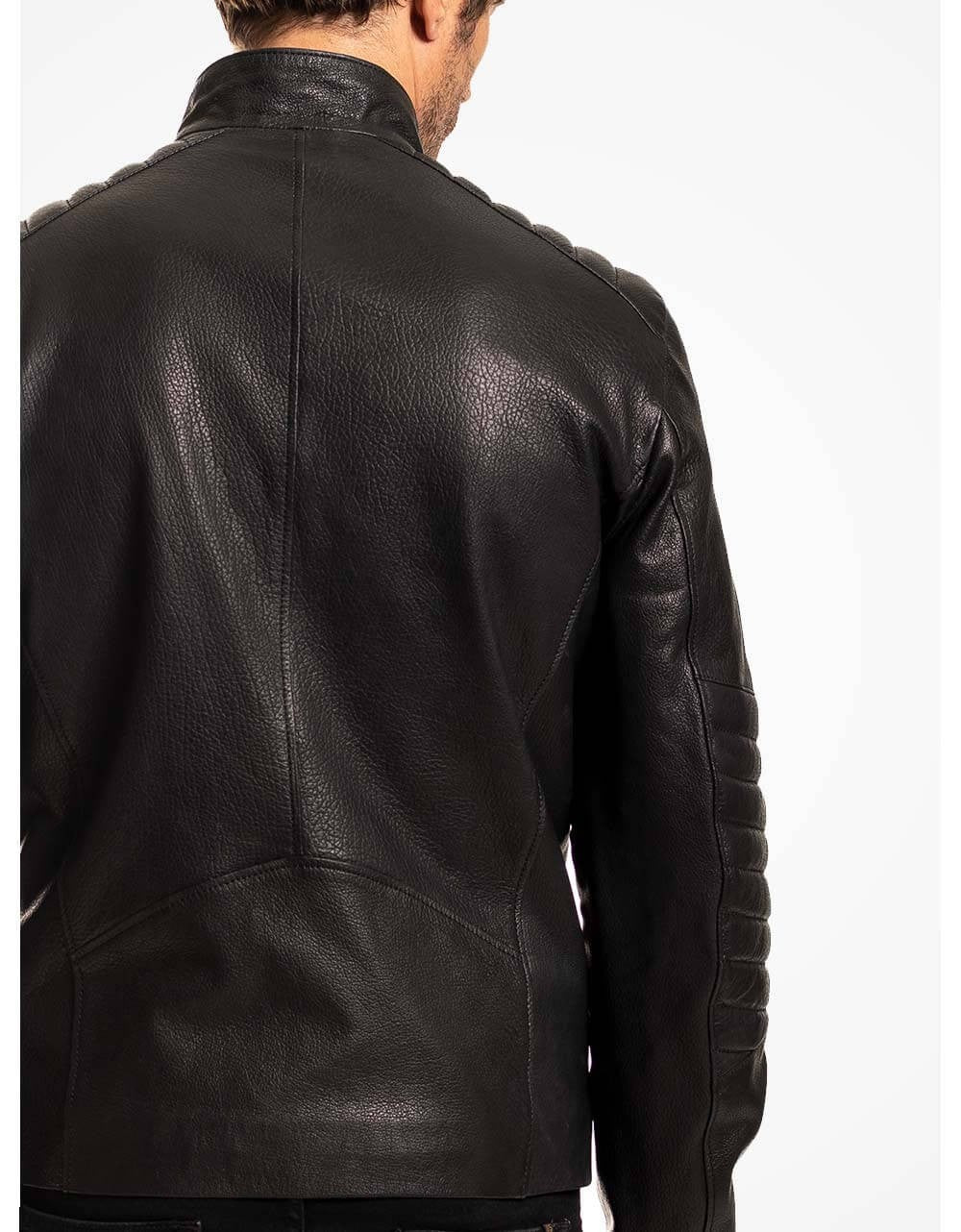 Black leather jacket worn by a person on a white background