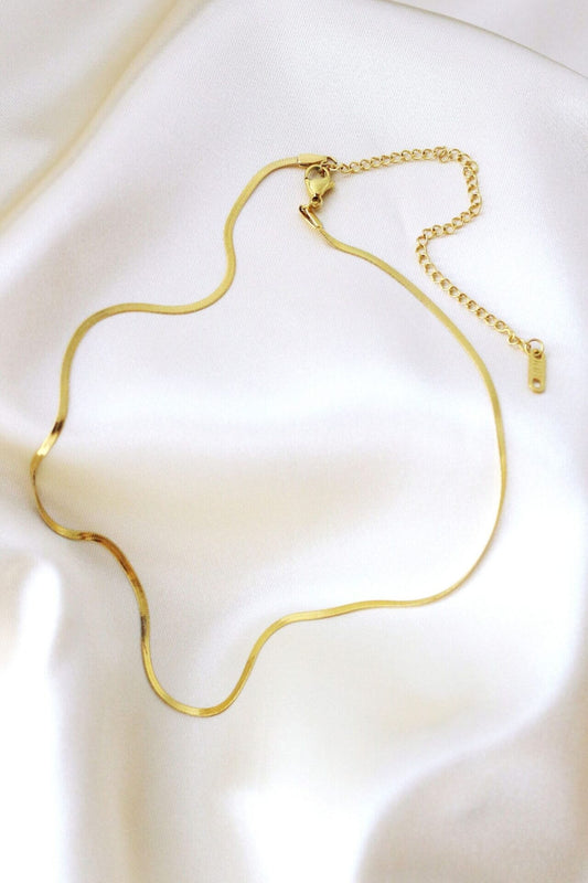 Gold necklace on a white background