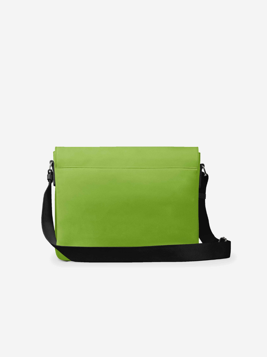 Green shoulder bag with black strap on a white background