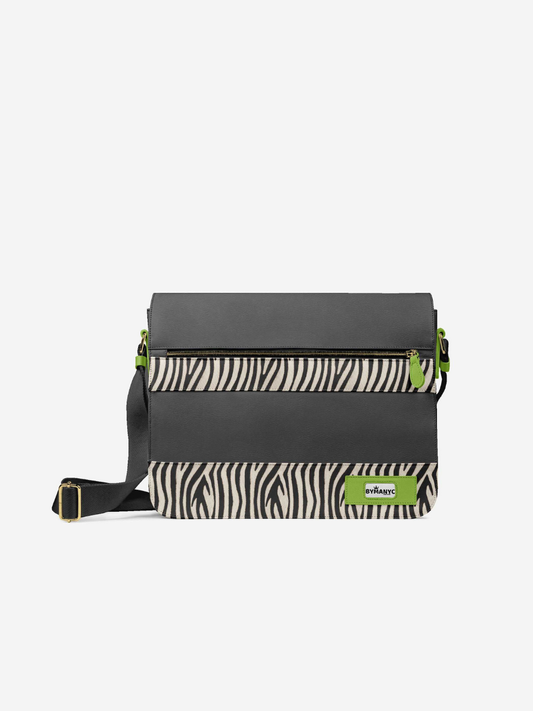 Black crossbody bag with zebra pattern and green accents on a white background