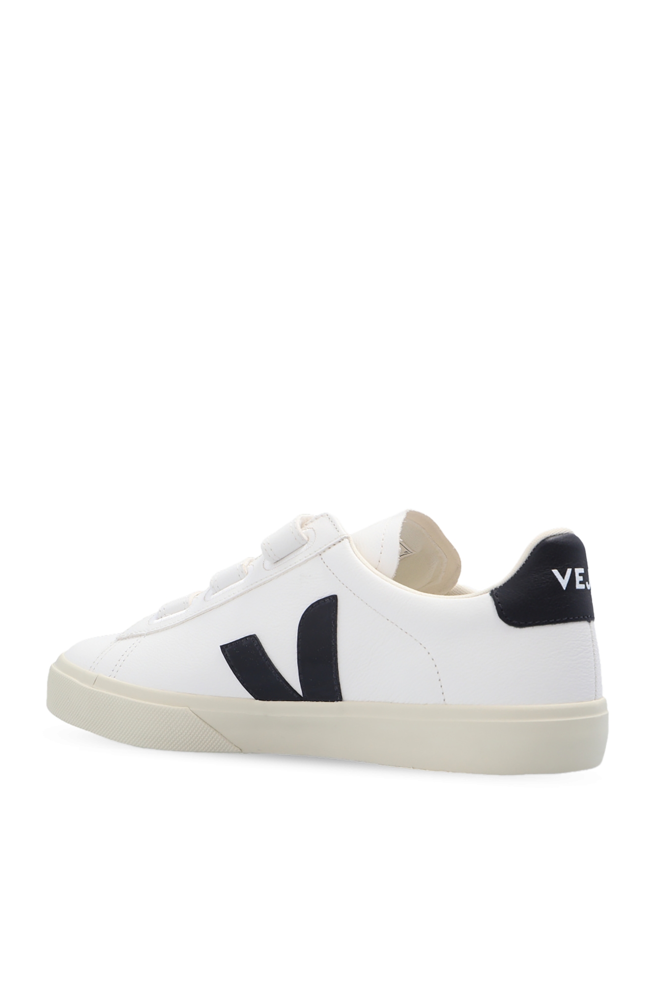 White sneaker with black logo on a white background
