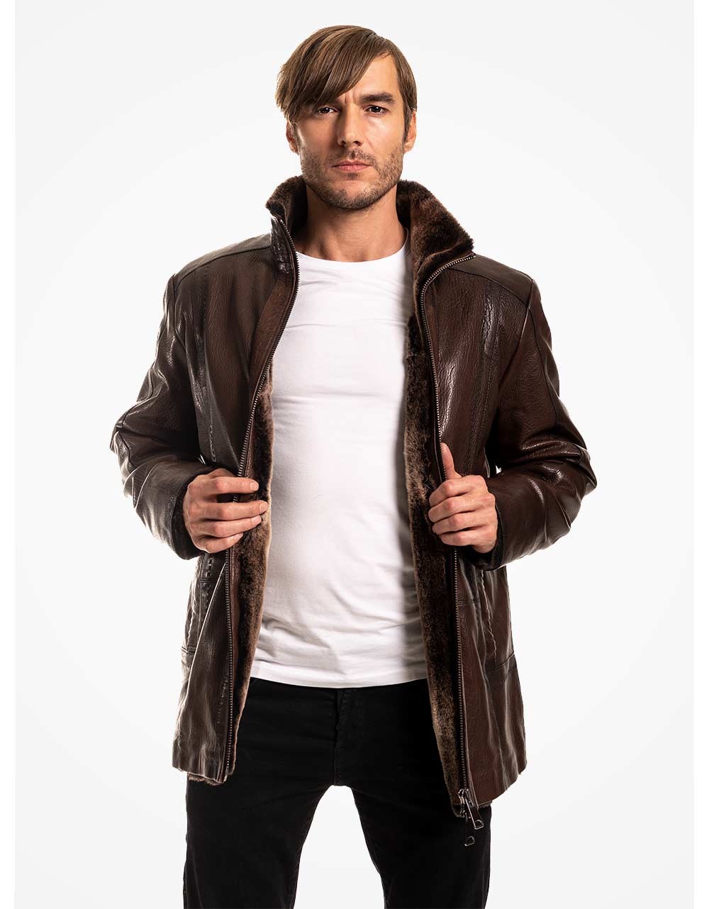 Man wearing a brown leather coat over a white shirt on a white background