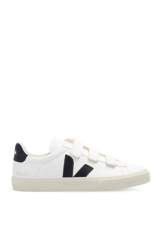 White sneaker with black accents on a white background