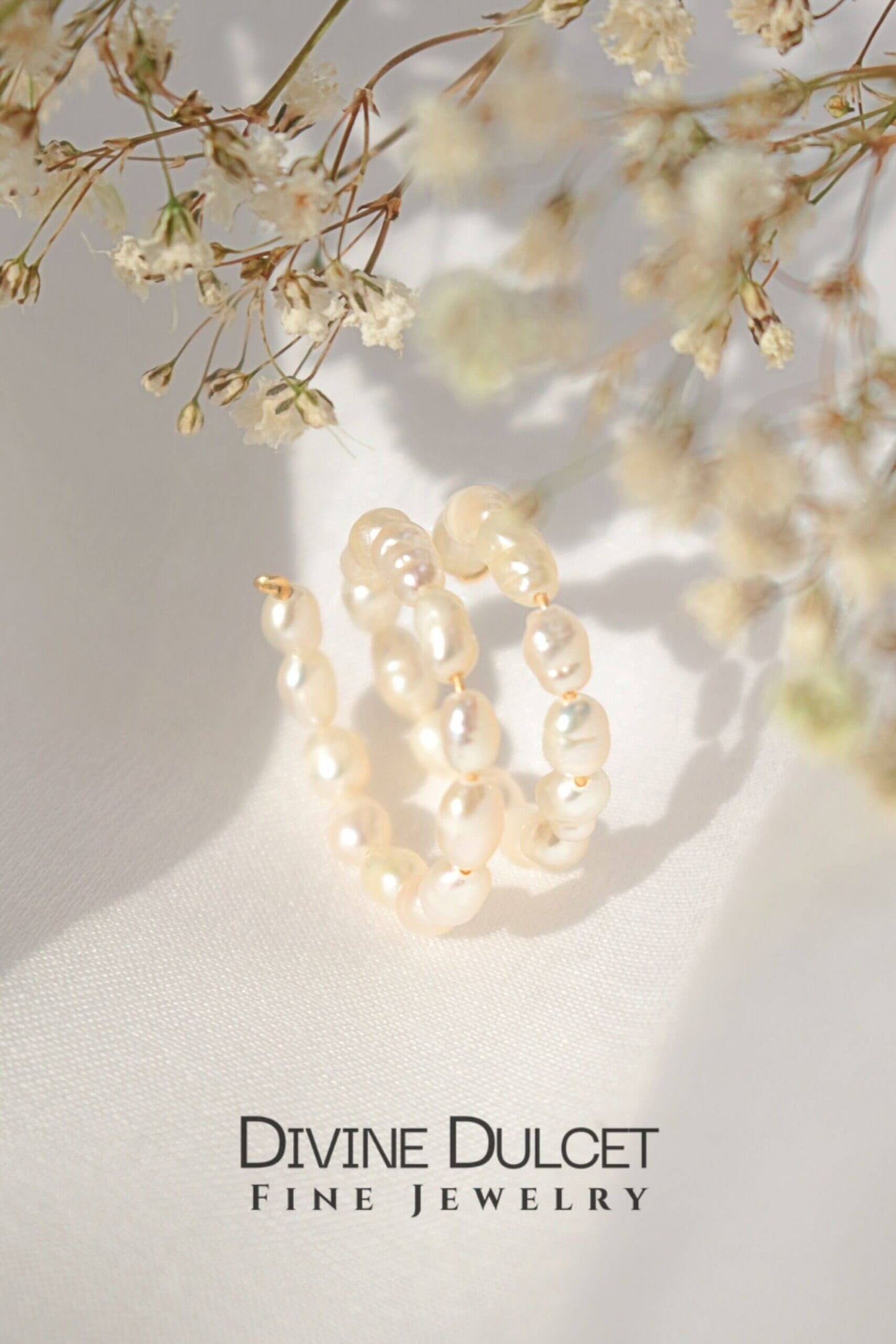 Pearl ring on a light background with 'Divine Dulcet Fine Jewelry' branding.