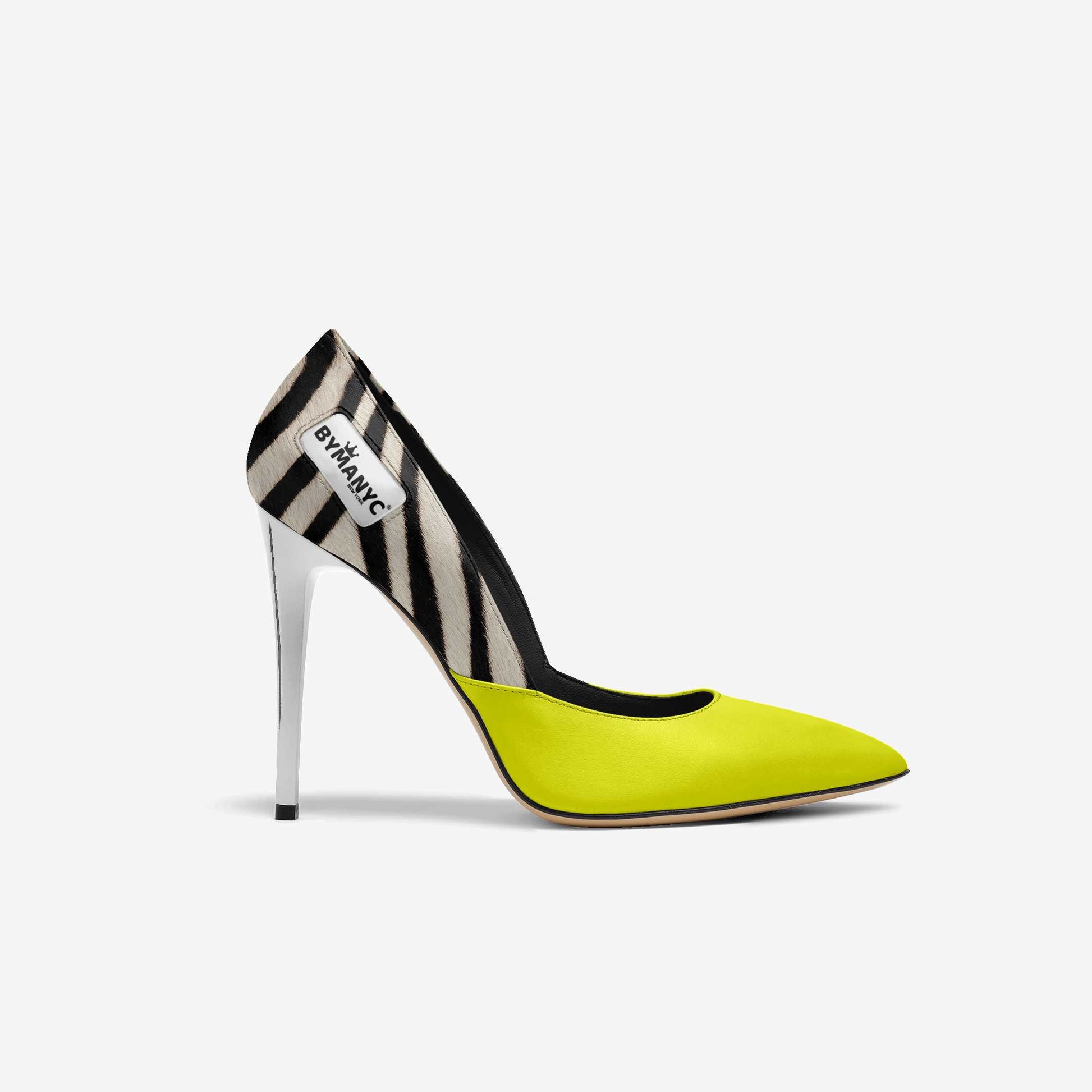 Zebra-striped high-heeled shoe with neon yellow sole on a white background