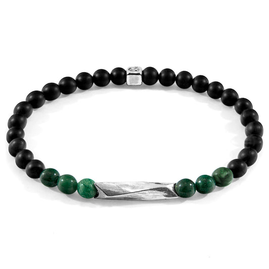 Black and green beaded bracelet with a silver clasp on a white background