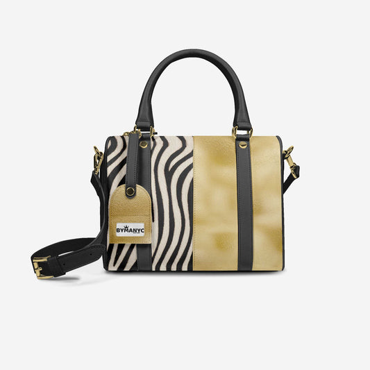 Handbag with zebra pattern and gold accents on a white background