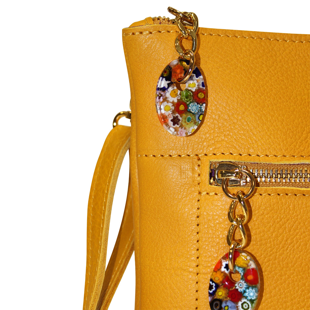 Yellow handbag with floral keychain on a white background