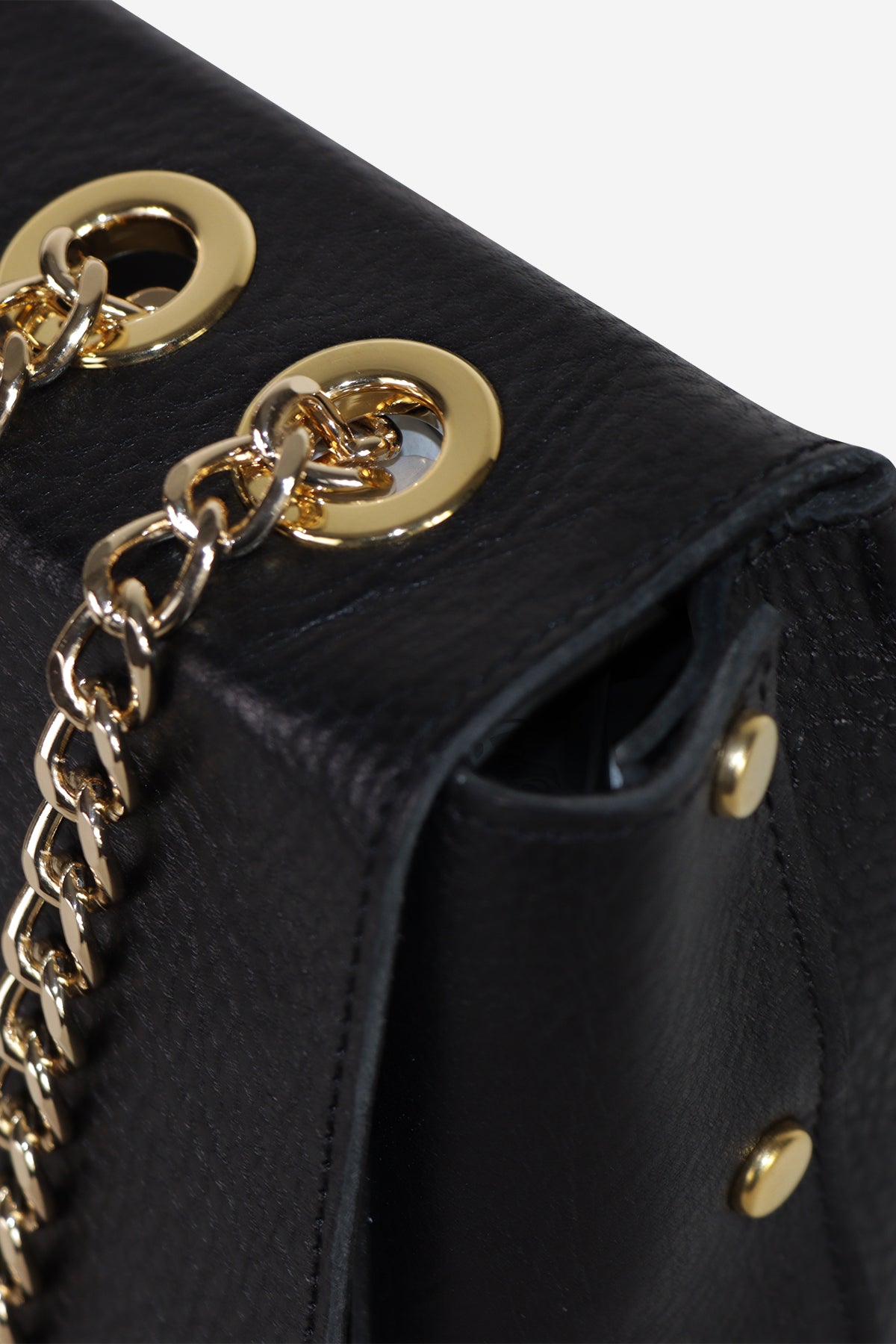 Black handbag with gold chain and hardware on a white background