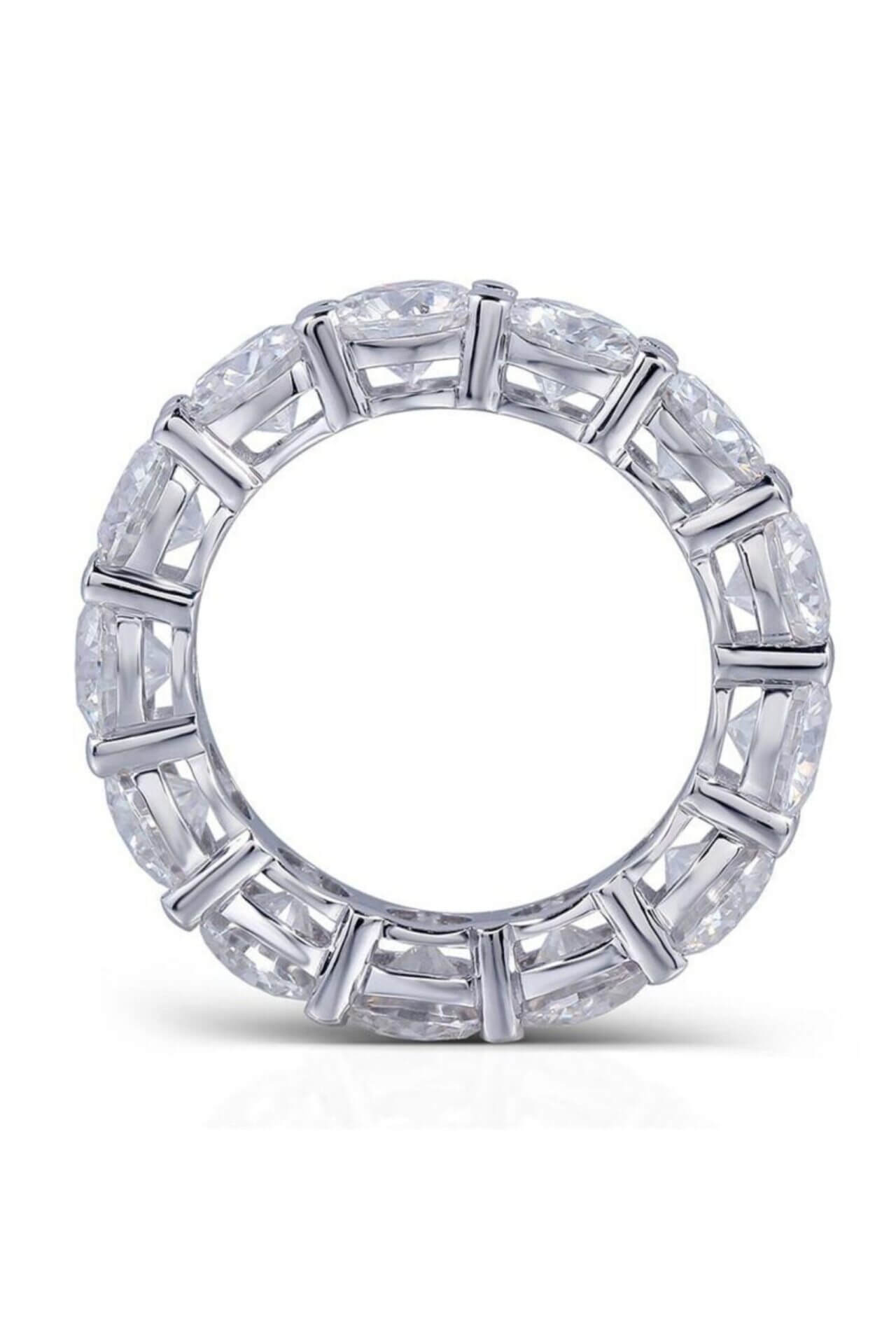 Silver ring with diamond accents on a white background