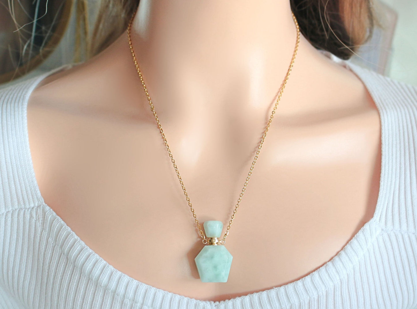 Necklace with a turquoise pendant on a mannequin