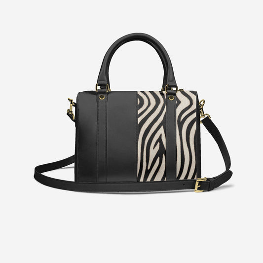 Black handbag with zebra print detail on a white background