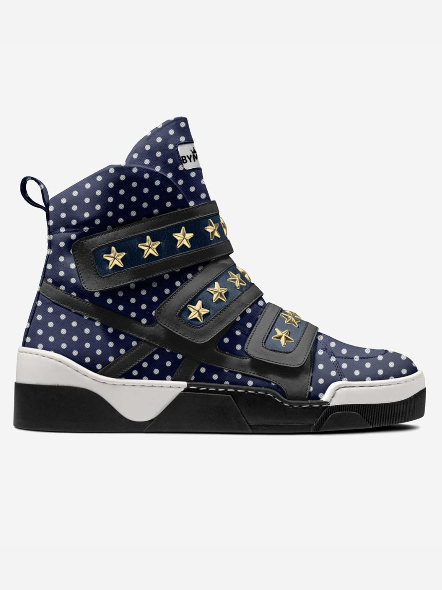 Navy high-top sneaker with white polka dots and gold star accents on a white background