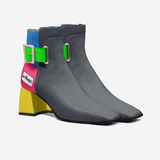 Gray ankle boots with colorful buckles on a white background