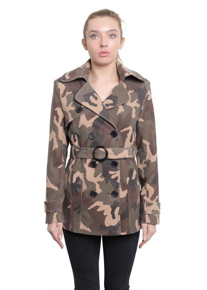 Woman wearing a camouflage coat on a white background